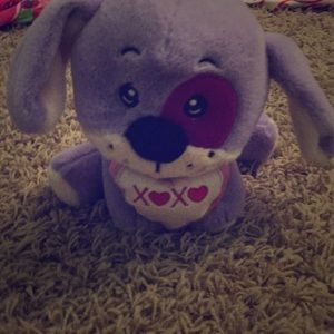 Fluffy purple dog with xoxo heart attached